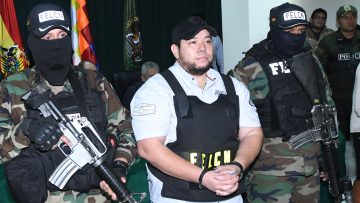 Pedro Montenegro is escorted by members of the FELCN in Santa Cruz