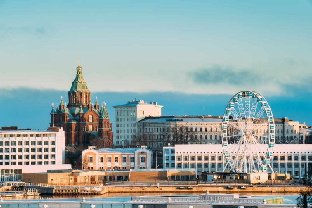 Helsinki, Finland. View Of Uspenski Cathedral On Hill And Ferris Wheel At Winter Day. Eastern Orthodox Cathedral Dedicated To Dormition Of The Theotokos Virgin Mary.